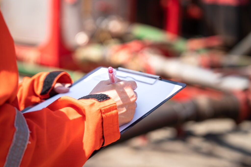 A person is filling out a quality control checklist