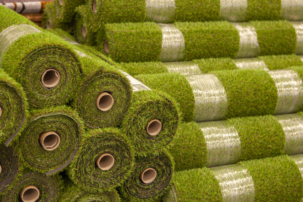High-quality synthetic grass rolls prepared for export, showcasing durable fibers, proper tufting density, and retail-ready packaging for European markets